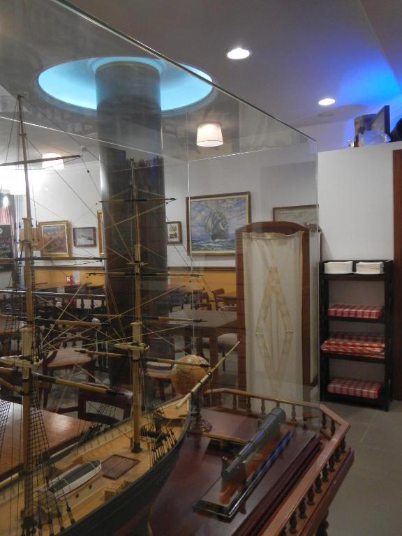 a museum with a model ship in a room at Hostal Vila del Mar in Lloret de Mar