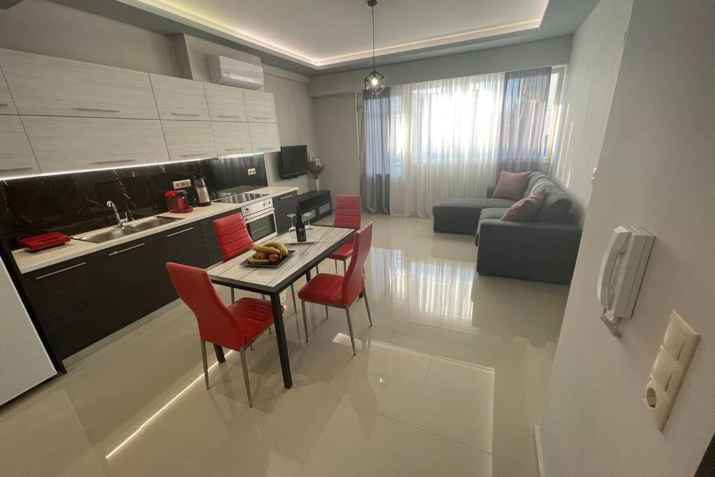 A kitchen or kitchenette at Maxim Deluxe Apartment
