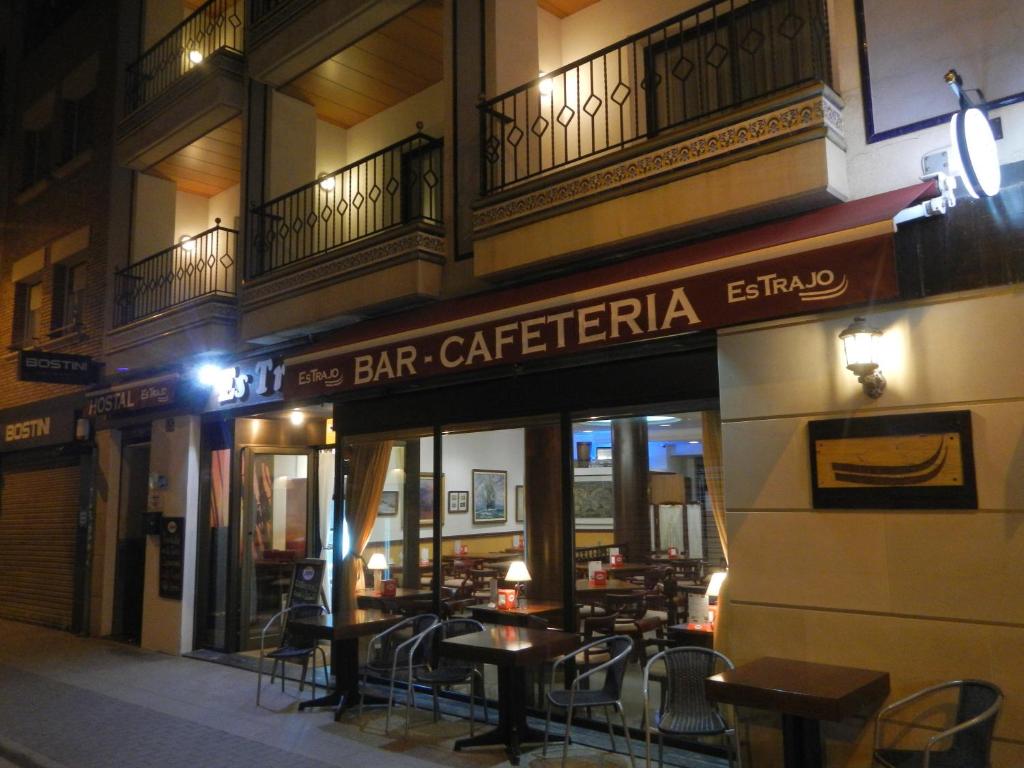 a restaurant with tables and chairs outside of a building at Hostal Vila del Mar in Lloret de Mar
