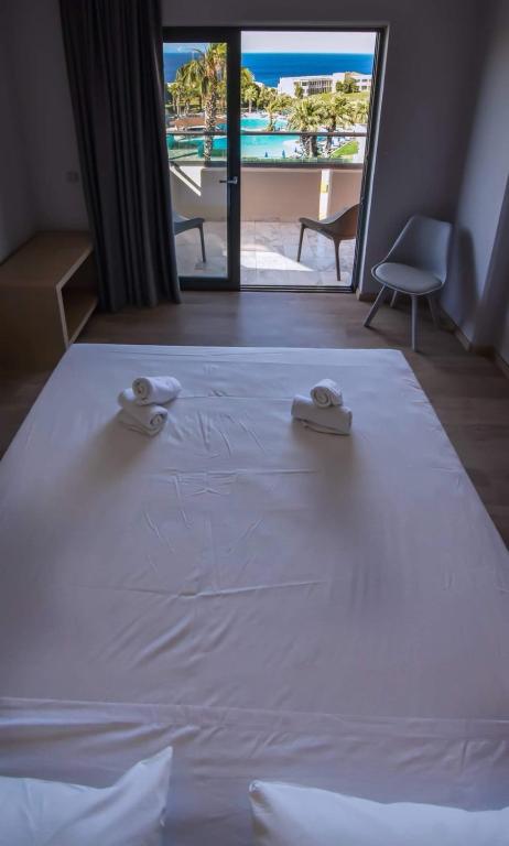 Postel nebo postele na pokoji v ubytování Kresten Palace Hotel