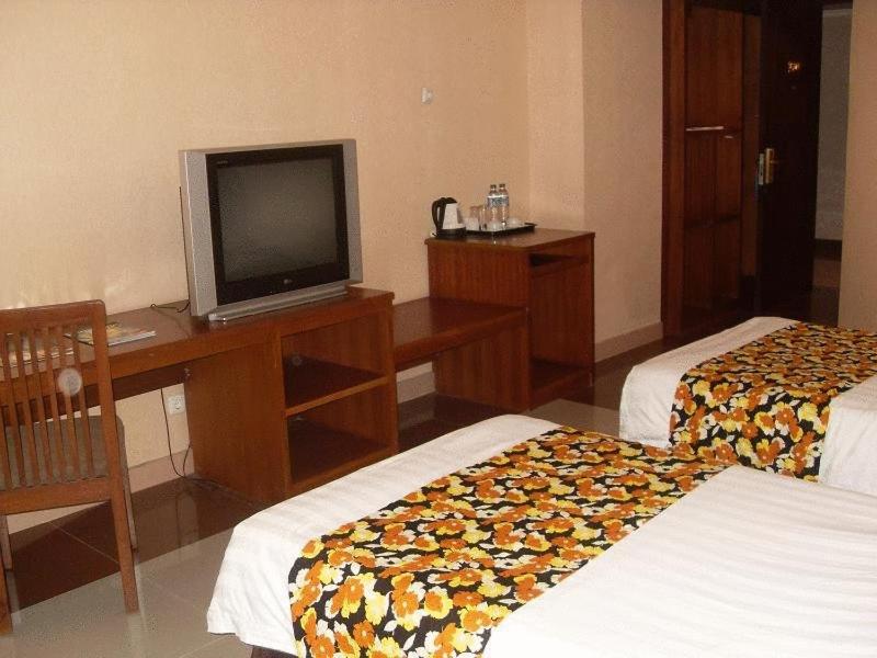 Postel nebo postele na pokoji v ubytování Hotel Oval