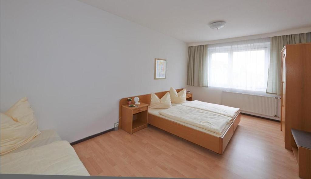 Postel nebo postele na pokoji v ubytování Alpha Apparthotel leipzig-Rötha
