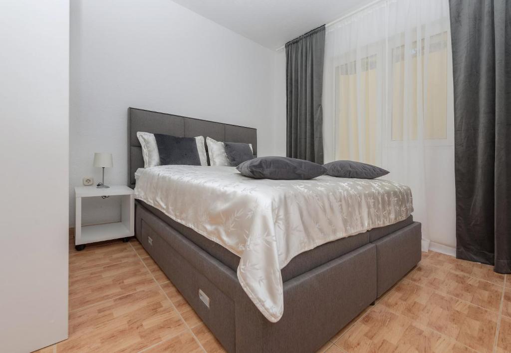 Postel nebo postele na pokoji v ubytování Apartments Tila