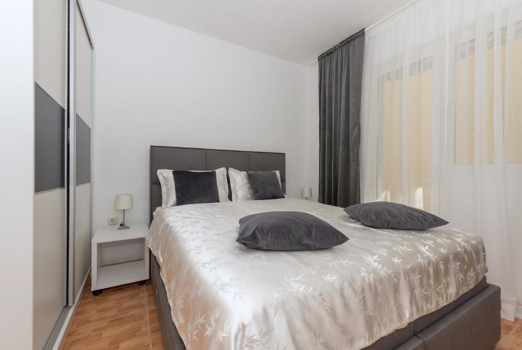 Postel nebo postele na pokoji v ubytování Apartments Tila