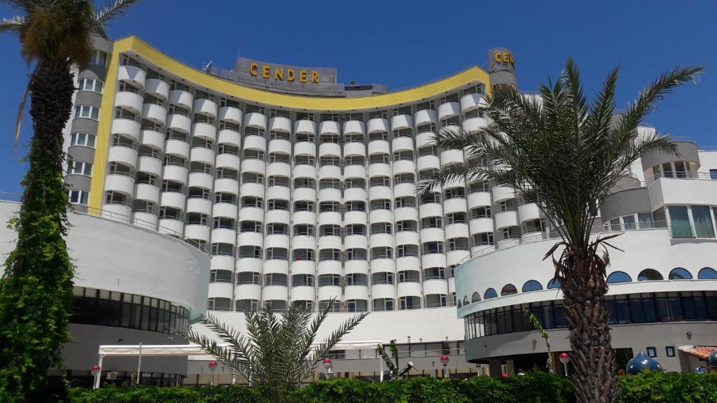 a large hotel with a large white building at Cender Hotel in Antalya