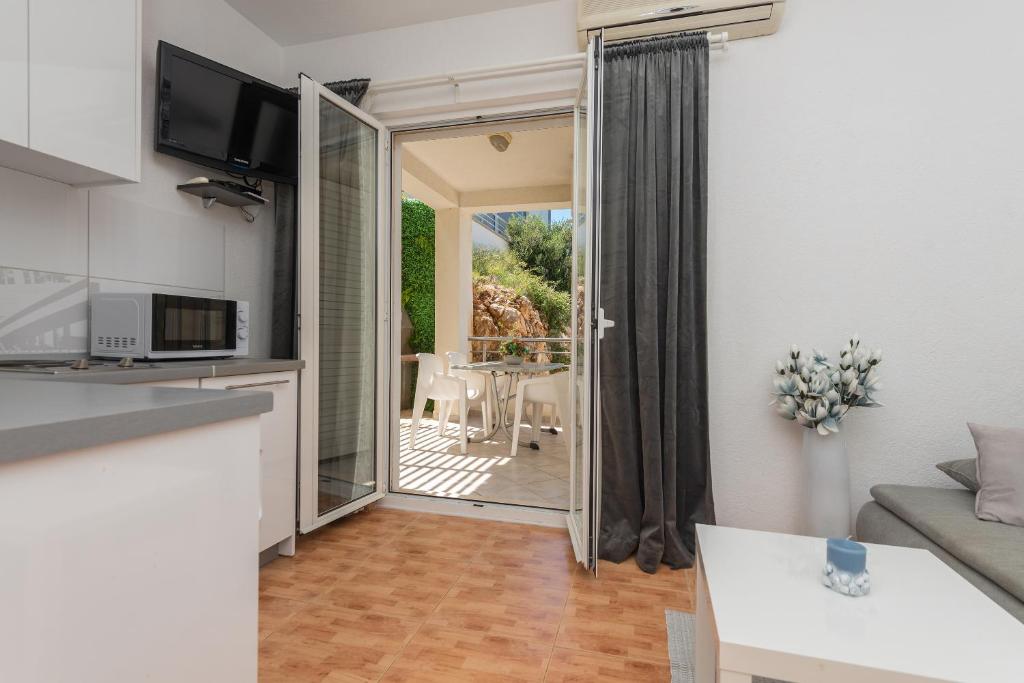 Kuchyň nebo kuchyňský kout v ubytování Apartments Tila
