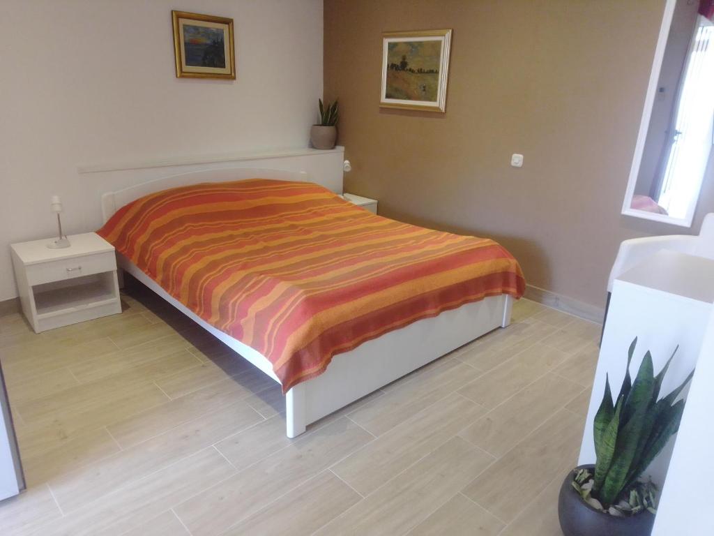 Postel nebo postele na pokoji v ubytování Apartments Haracic
