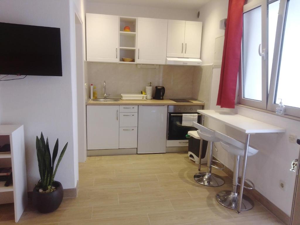 Kuchyň nebo kuchyňský kout v ubytování Apartments Haracic