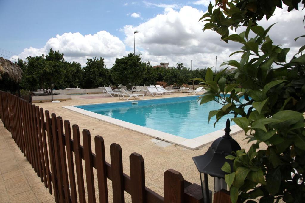 The swimming pool at or close to Il Giardino Del Sole