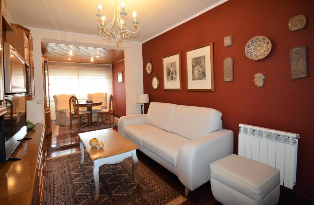 a living room with a couch and a table at Santiago Apartment in Santiago de Compostela