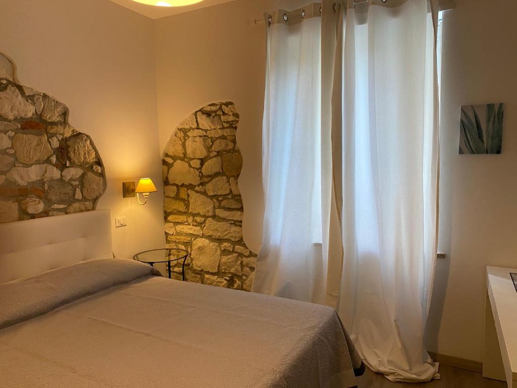 Postel nebo postele na pokoji v ubytování UNIQUE ROOMS