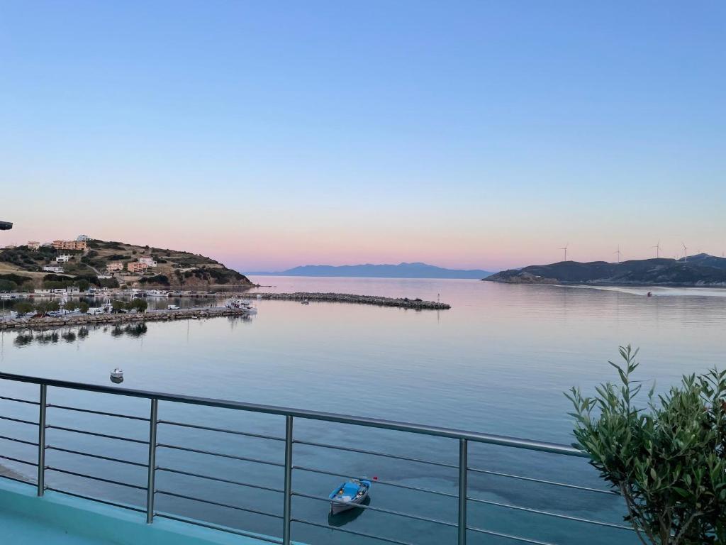 a view of a body of water with a boat in it at Thalassa view in Agioi Apostoli