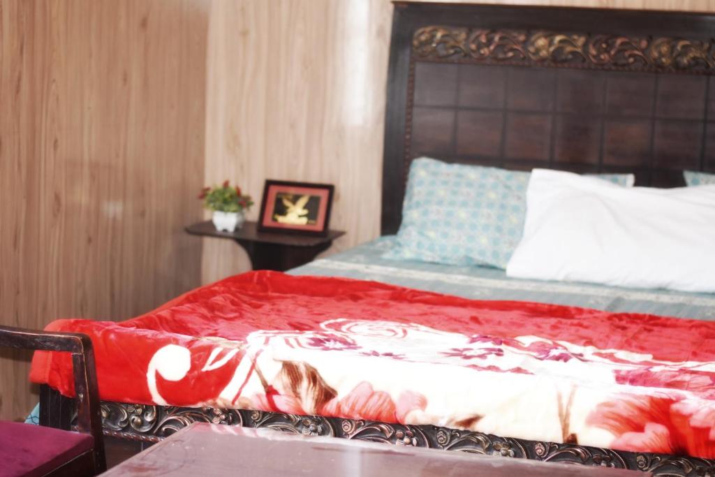 Postel nebo postele na pokoji v ubytování Skardu Lodge