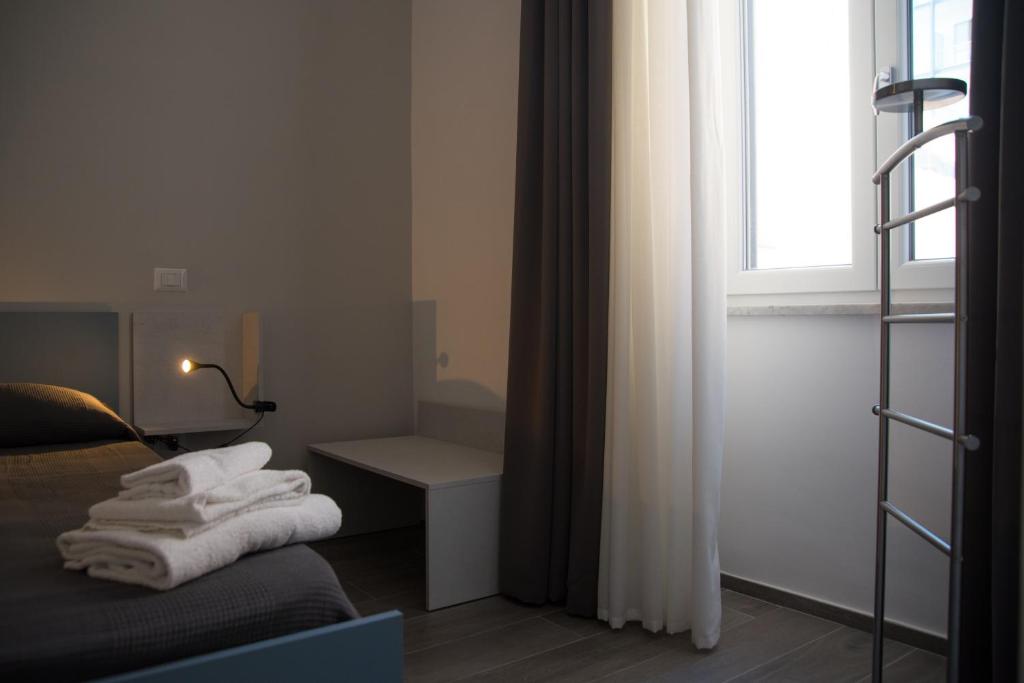 Łóżko lub łóżka w pokoju w obiekcie Casa Felix