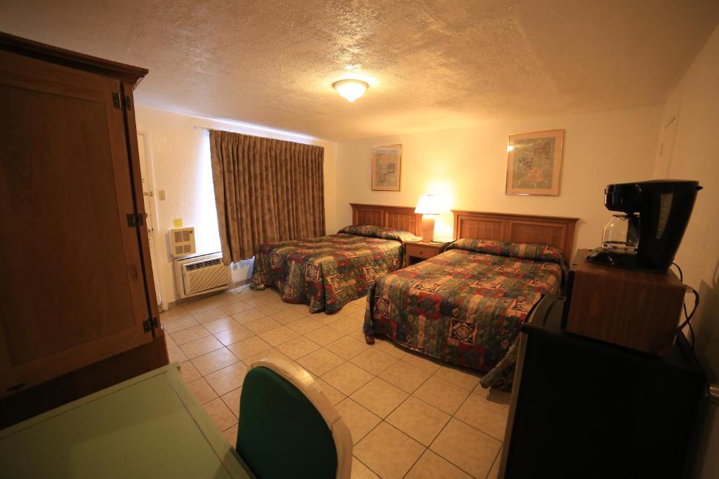 Postel nebo postele na pokoji v ubytování El Ray Motel