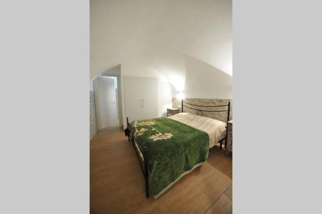 Łóżko lub łóżka w pokoju w obiekcie GaDa Home -centro storico -