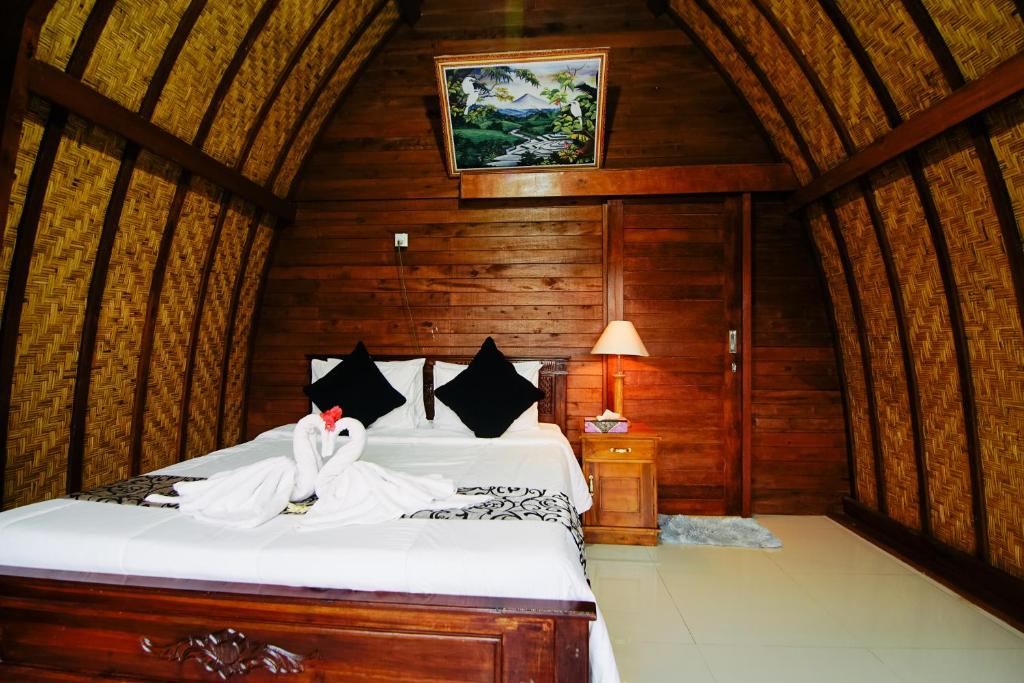 Postel nebo postele na pokoji v ubytování Pondok Bali Cottage
