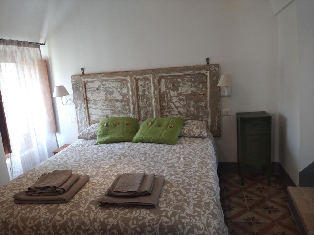 Postel nebo postele na pokoji v ubytování Agriturismo LE CASE ROTTE
