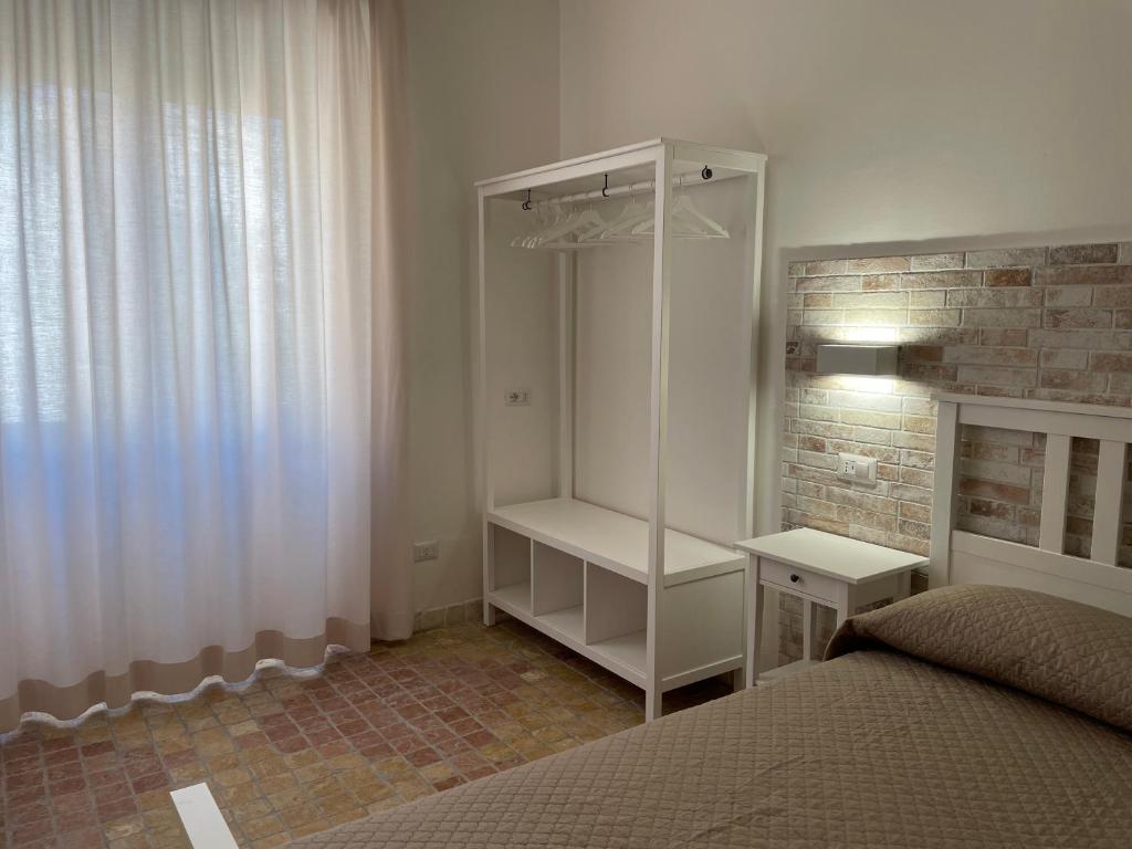 Postel nebo postele na pokoji v ubytování Sa Vivenda Suite