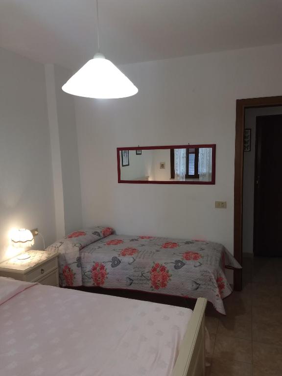 A bed or beds in a room at Appartamenti per vacanze Valle Onesta
