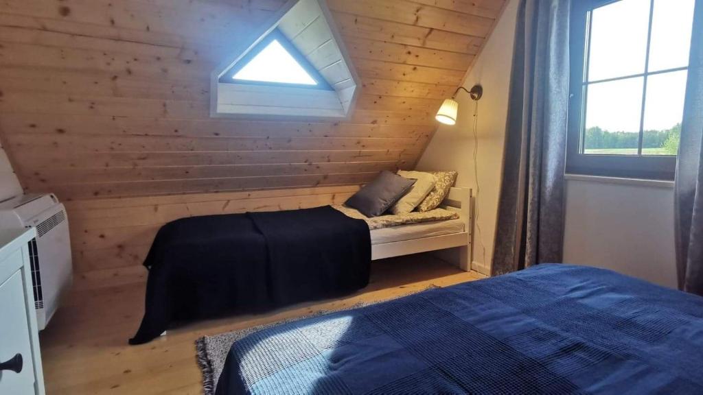Posteľ alebo postele v izbe v ubytovaní Domek nad Marychą - Zelwa