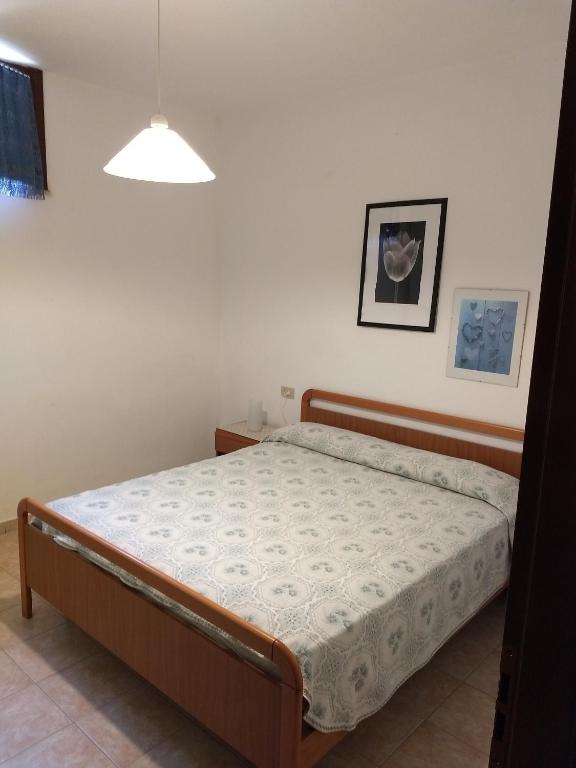 A bed or beds in a room at Appartamenti per vacanze Valle Onesta