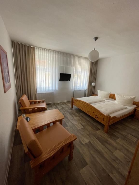 Postel nebo postele na pokoji v ubytování Hotel Garni „zum Bären“