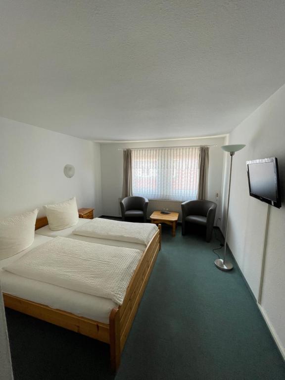 Postel nebo postele na pokoji v ubytování Hotel Garni „zum Bären“