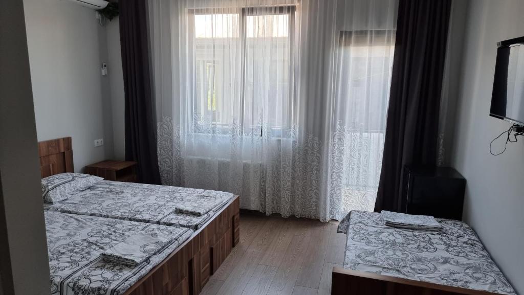 Llit o llits en una habitació de French Hotel