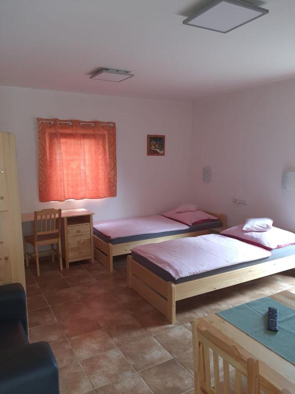 Postel nebo postele na pokoji v ubytování Penzion U Pavla