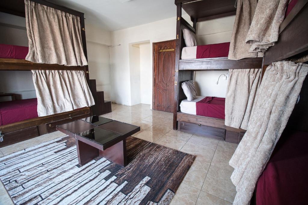 Postel nebo postele na pokoji v ubytování Castle Hostel