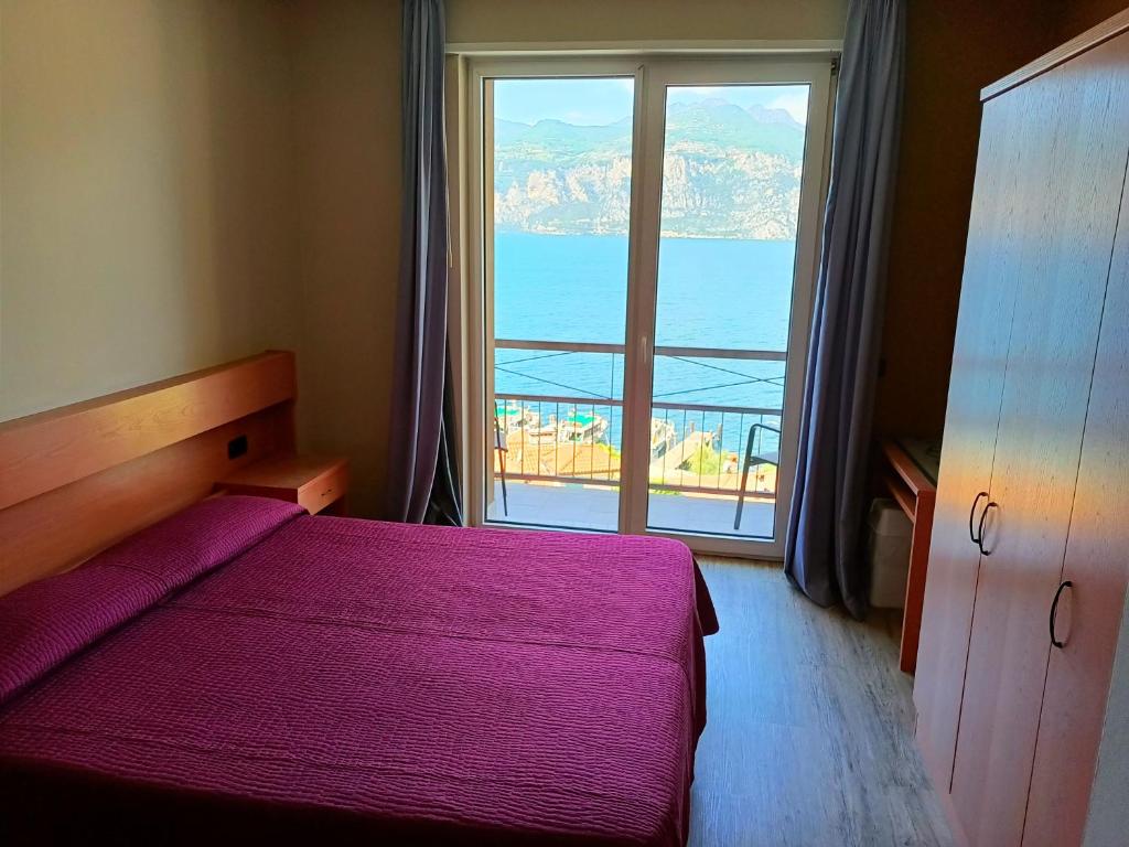 Postel nebo postele na pokoji v ubytování Hotel Antonella