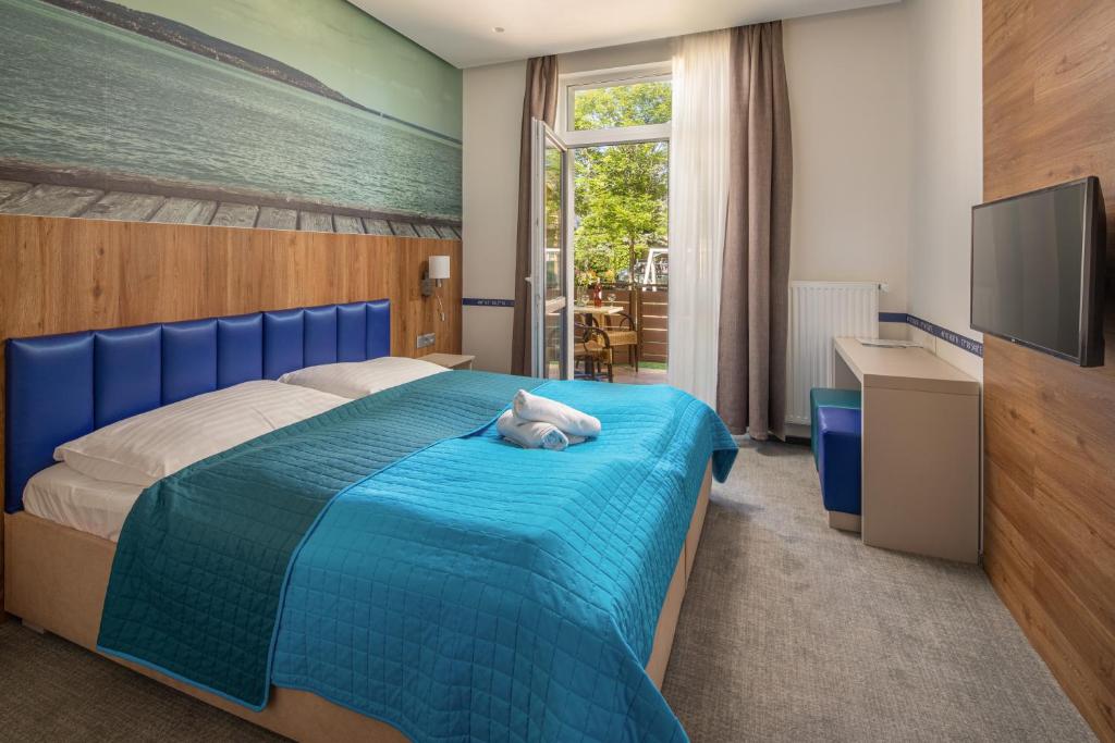 Postel nebo postele na pokoji v ubytování Hotel Solero