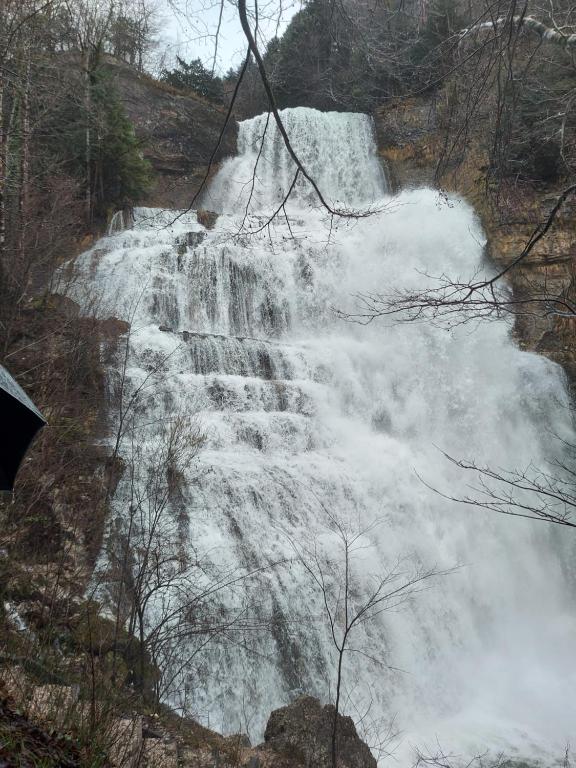 a waterfall on the side of a mountain at Chez sylvie in Morez