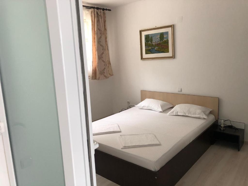 Postel nebo postele na pokoji v ubytování Pensiunea Cazanele Dunarii