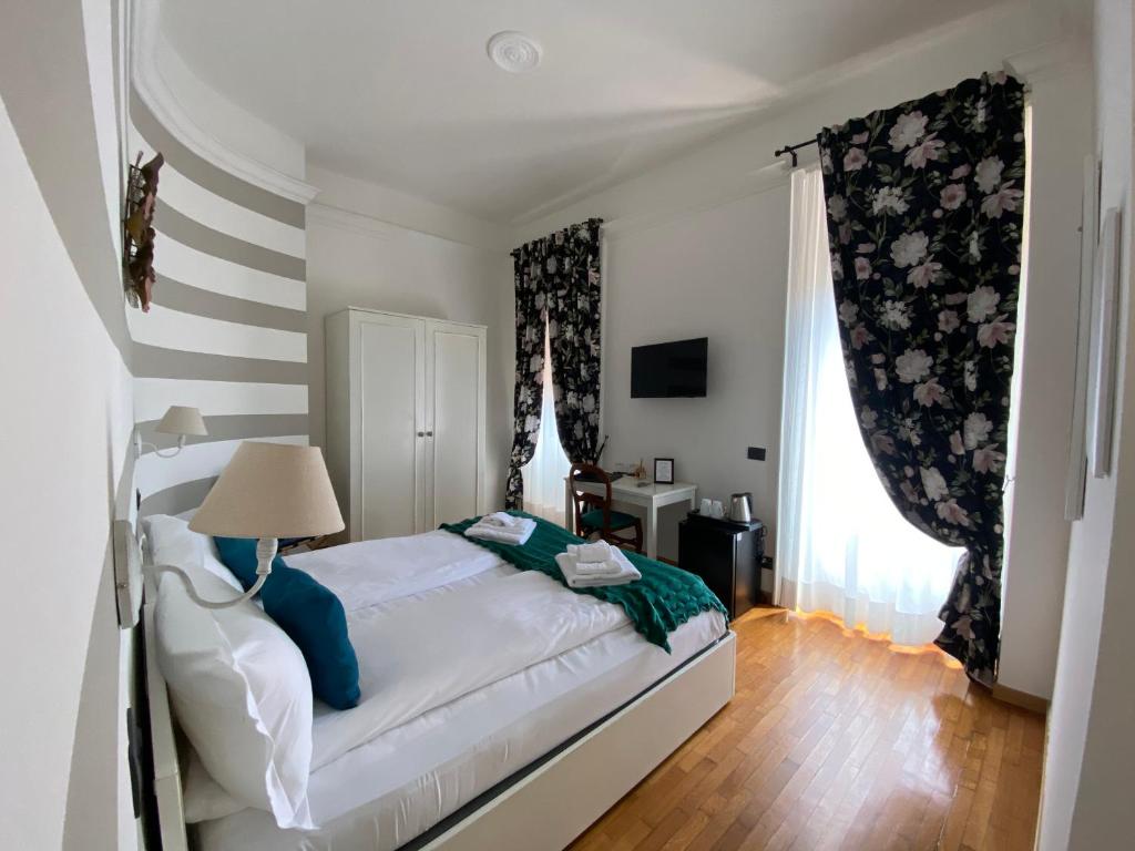 Postel nebo postele na pokoji v ubytování Hotel La Fontana