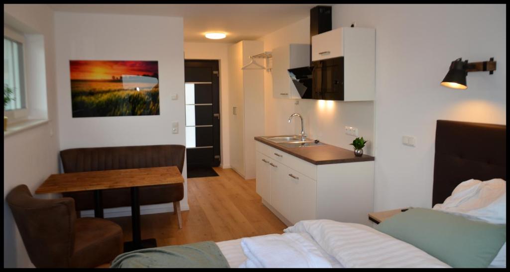 Kuchyň nebo kuchyňský kout v ubytování Fernweg Apartments