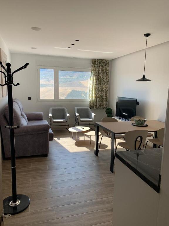 a living room with a couch and a table at Casa Raquel,caminito del Rey in Valle de Abdalagís