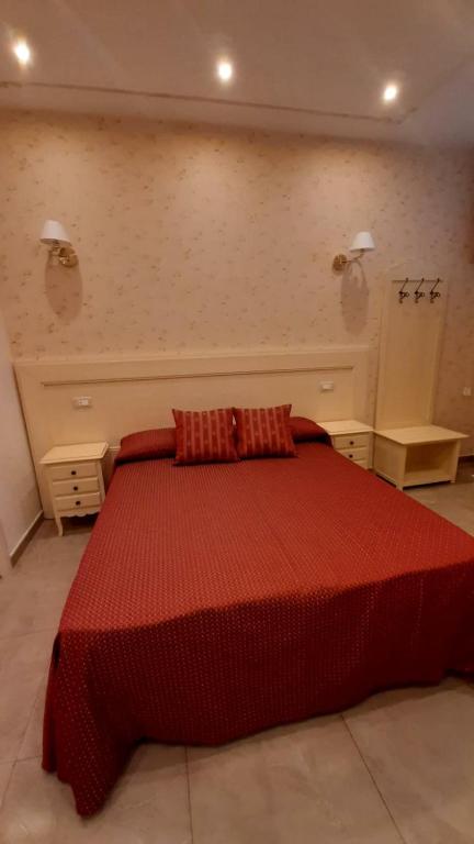 A bed or beds in a room at B&B Orchidea