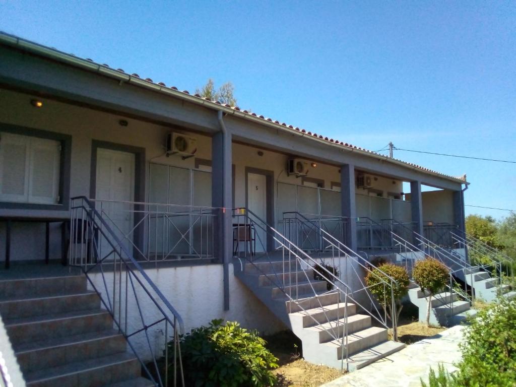 a building with stairs and a stair railing at Panorama Rooms in Kyllini