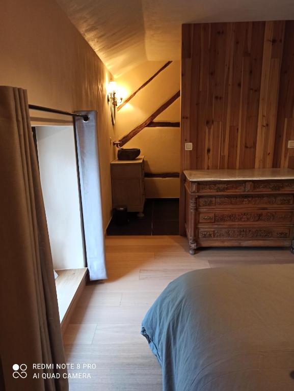 Postel nebo postele na pokoji v ubytování Le vieux tilleul