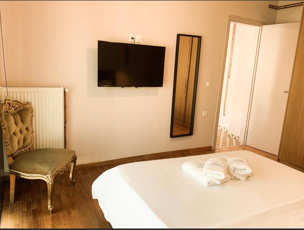 Postel nebo postele na pokoji v ubytování Boutique Homes Volos