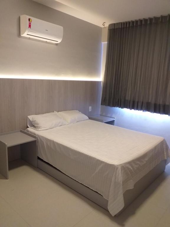Katil atau katil-katil dalam bilik di Flat Paraiso dos Coqueiros