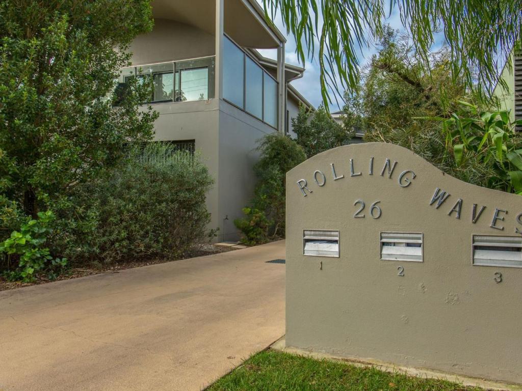 a building waisen sign in front of a building at Rolling Waves No 2 in Merimbula