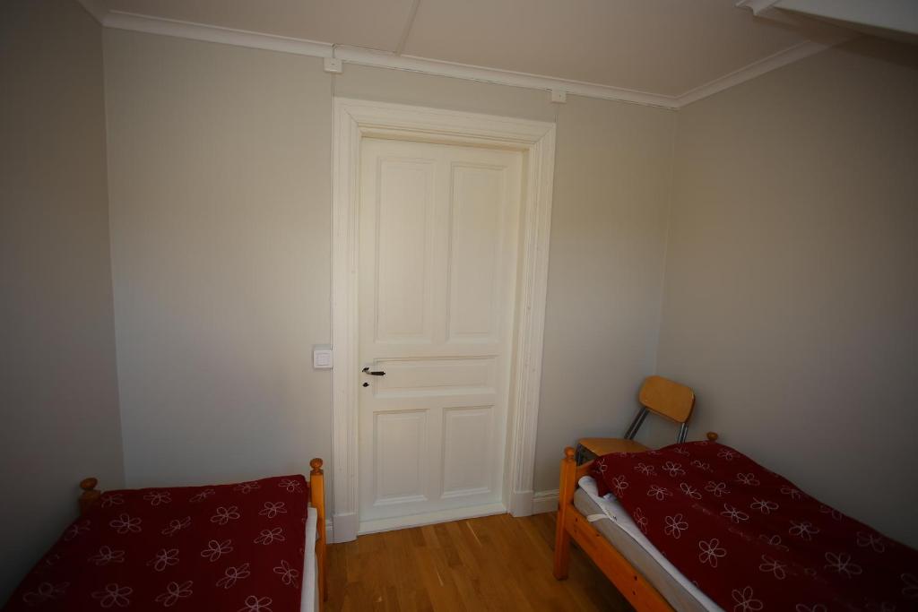 Postel nebo postele na pokoji v ubytování Semesterhemmet Sommarro