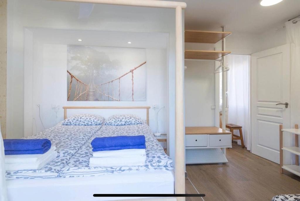 A bed or beds in a room at BEACH INN Apartment