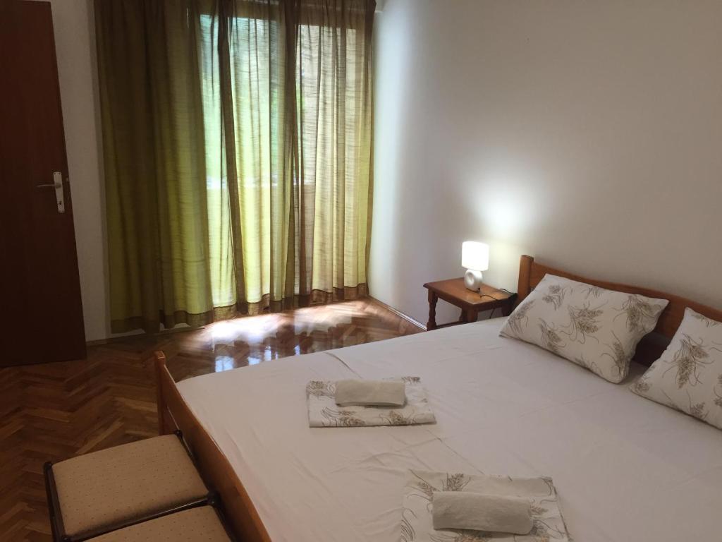 Postel nebo postele na pokoji v ubytování Apartman-Fenix