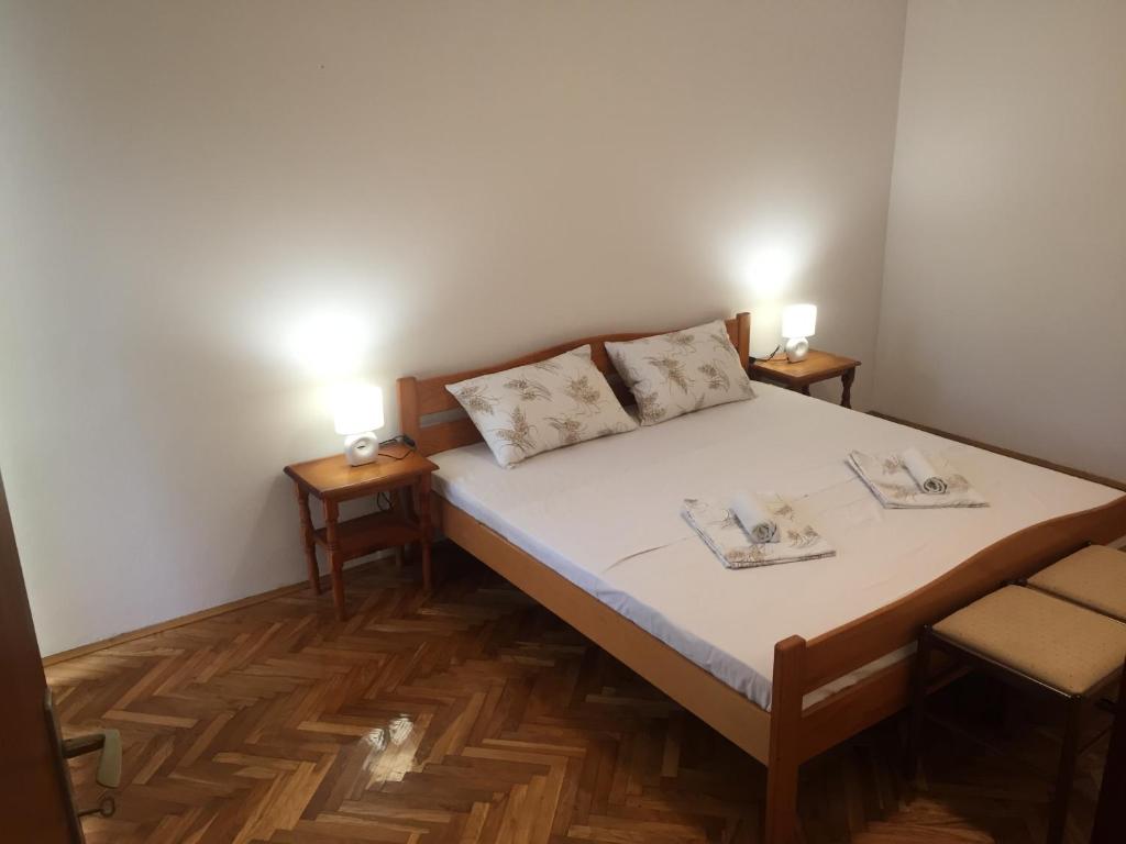 Postel nebo postele na pokoji v ubytování Apartman-Fenix