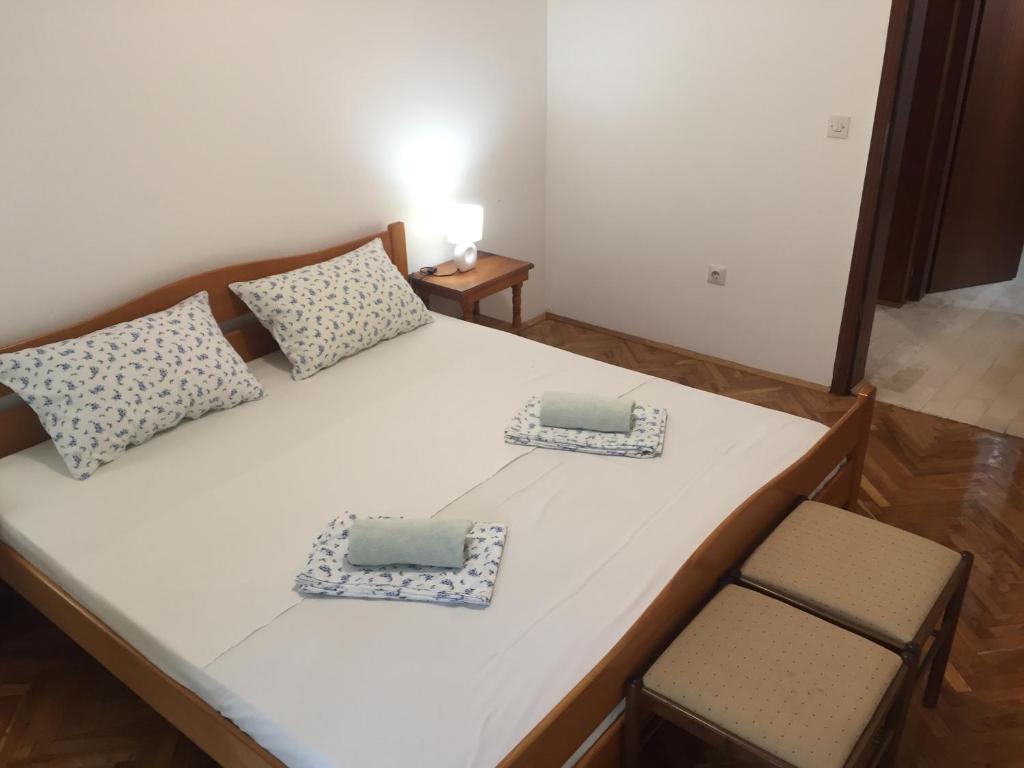 Postel nebo postele na pokoji v ubytování Apartman-Fenix