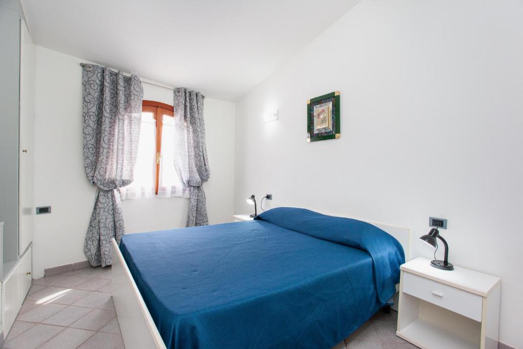 A bed or beds in a room at La Casa di Barbara